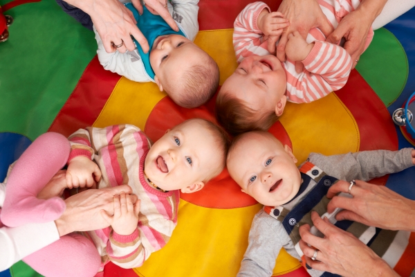 Overhead View Of Babies Having Fun At Nursery Playgroup